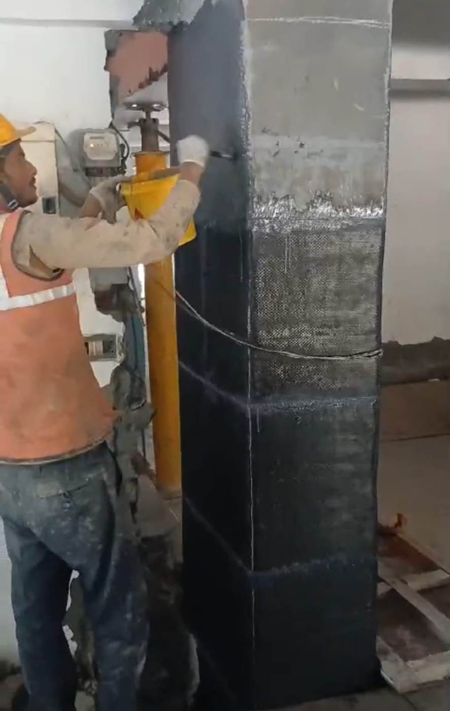 Finished carbon fiber wrapped bridge column with scaffolding