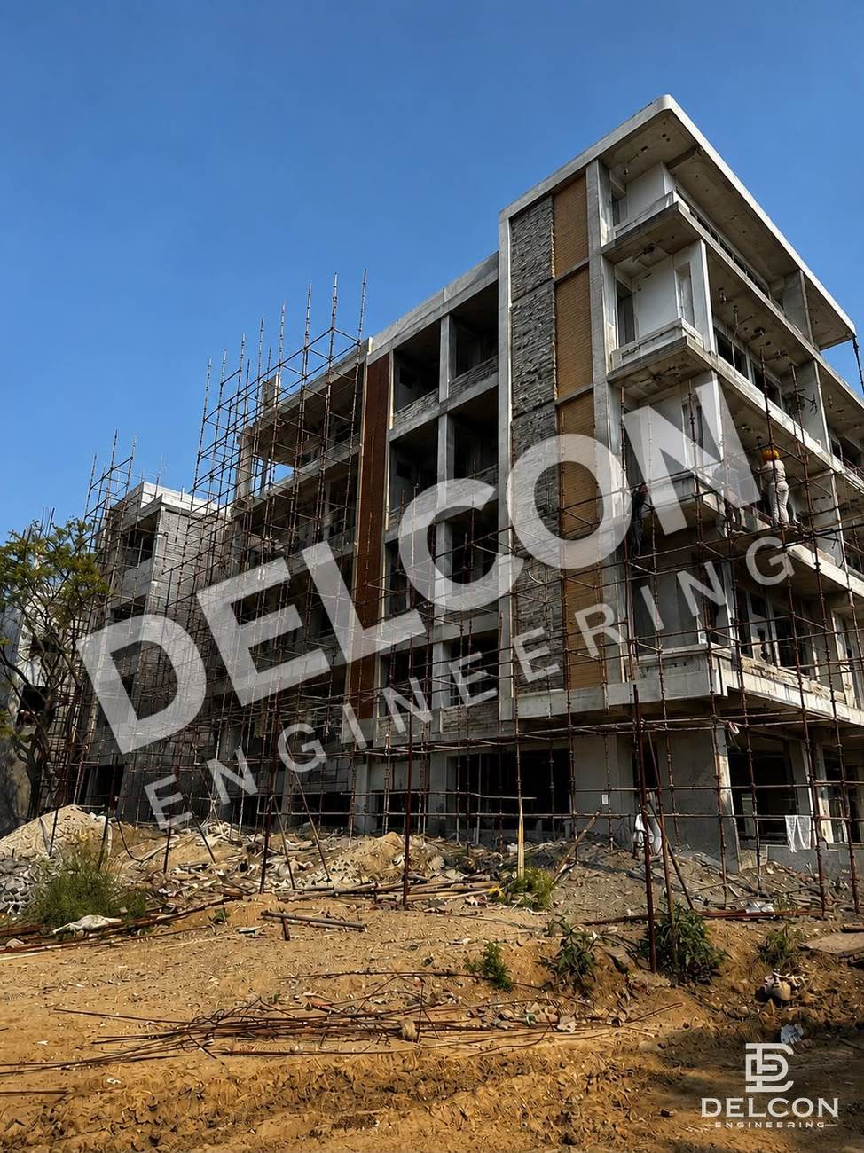 Multi-storey commercial building under construction with facade work and scaffolding