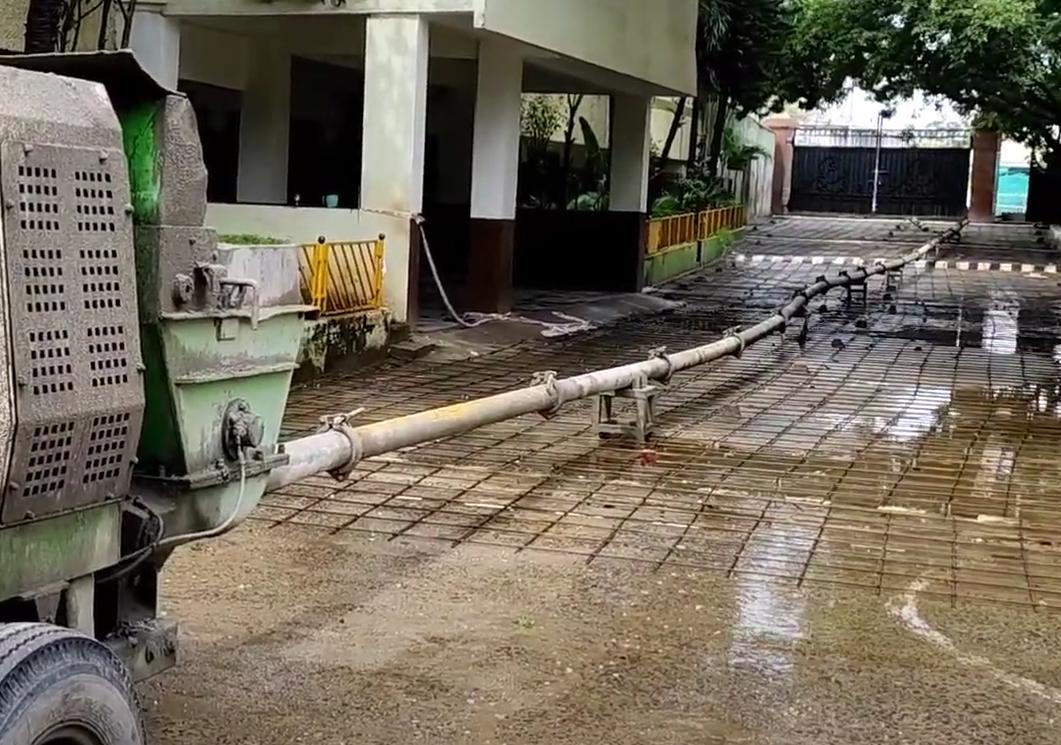 Concrete pump hose feeding an RCC road pour